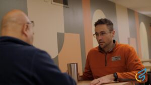 Two people talking in a cafe.