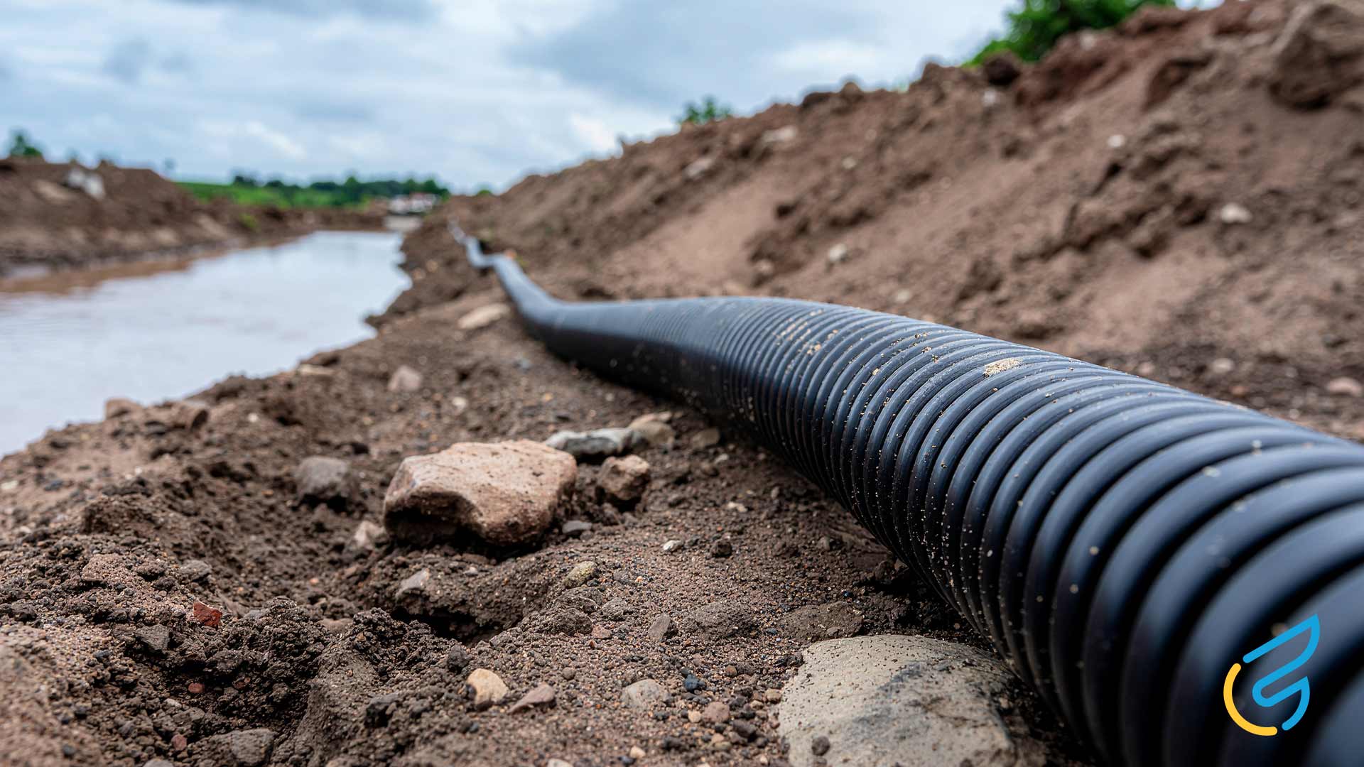 Home 28 Black pipe along muddy terrain