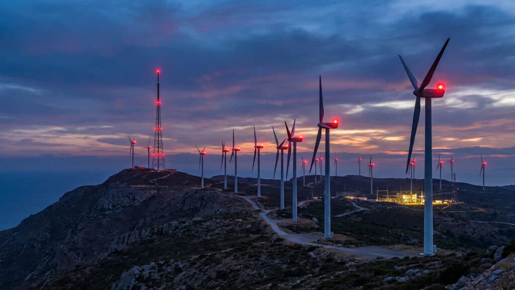 Wind turbines with red warning lights.