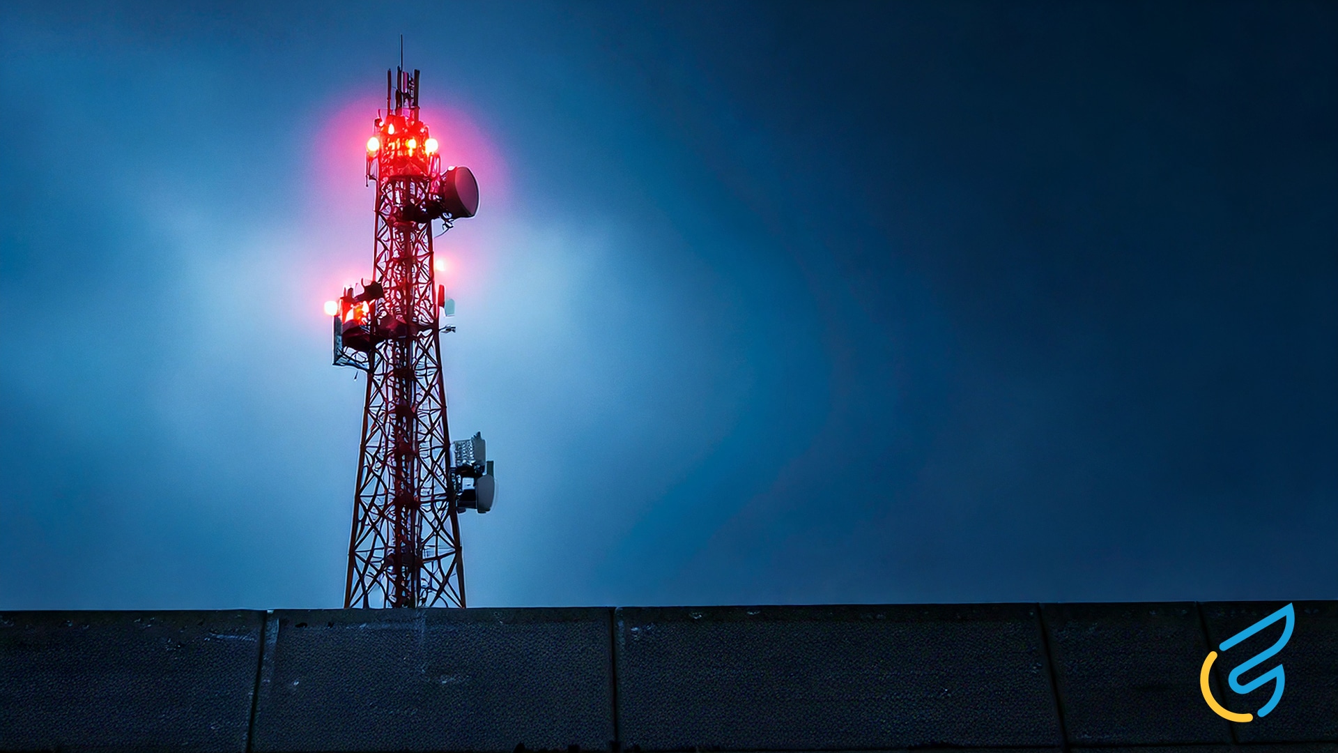 Illuminated communication tower at night