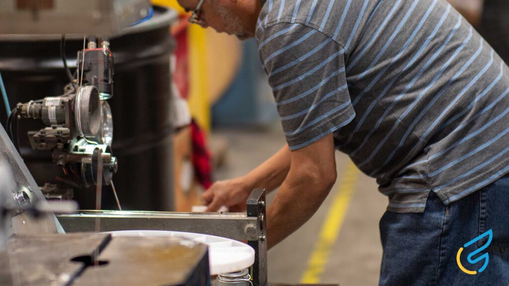 Man working on machinery in factory
