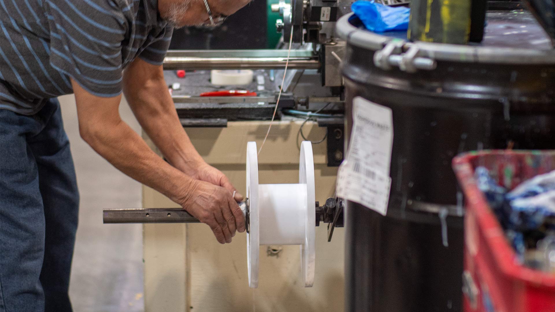 Man working with cable spool