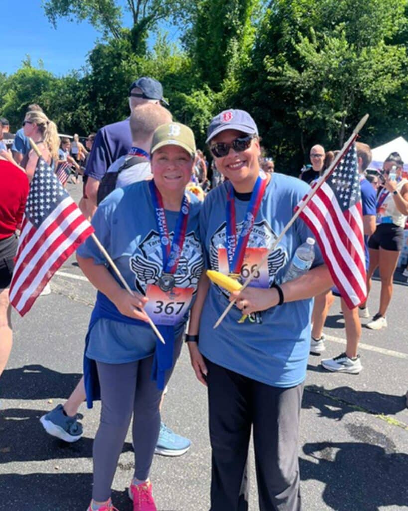 Wire Chasers Return to the Tarentino Strong 5K 5 Two women holding flags and medals