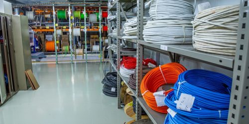 Colorful cables organized on shelves